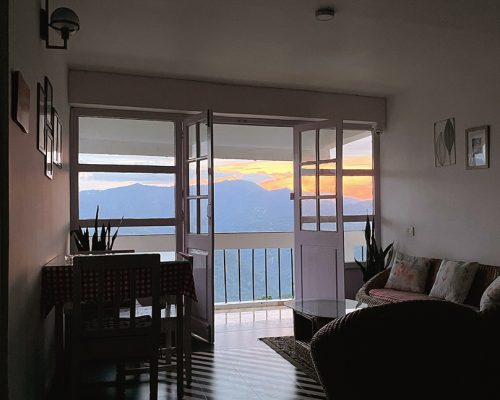 Shot of a beautiful setting of champagne and treats near a hot tub at night.
