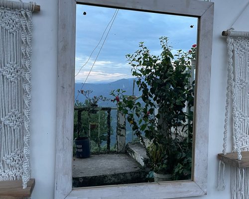 Shot of a beautiful setting of champagne and treats near a hot tub at night.